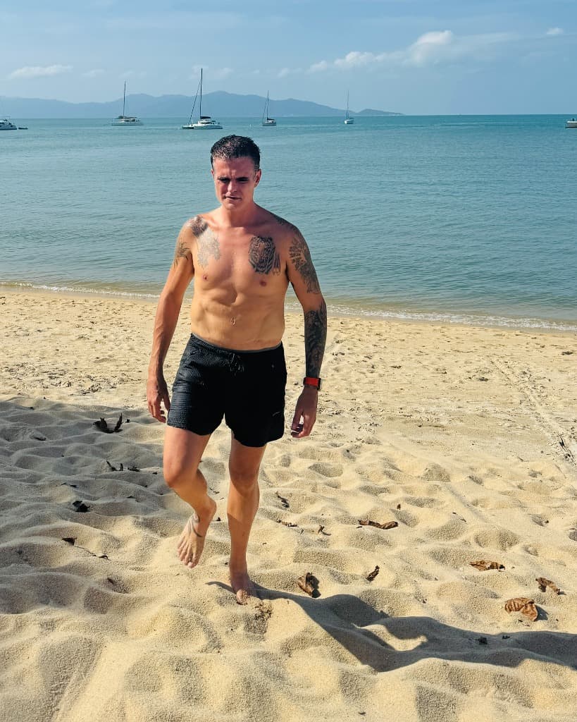 Jim Moore walking on the beach